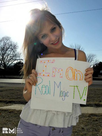 girl-outside-with-sign-rmtv